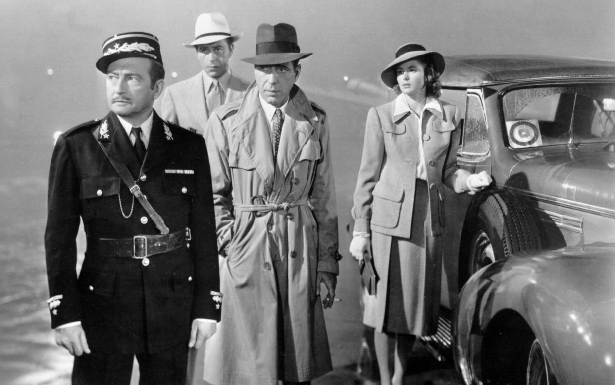 Claude Rains, Paul Henreid, Humphrey Bogart and Ingrid Bergman on the set of Casablanca - Getty Images