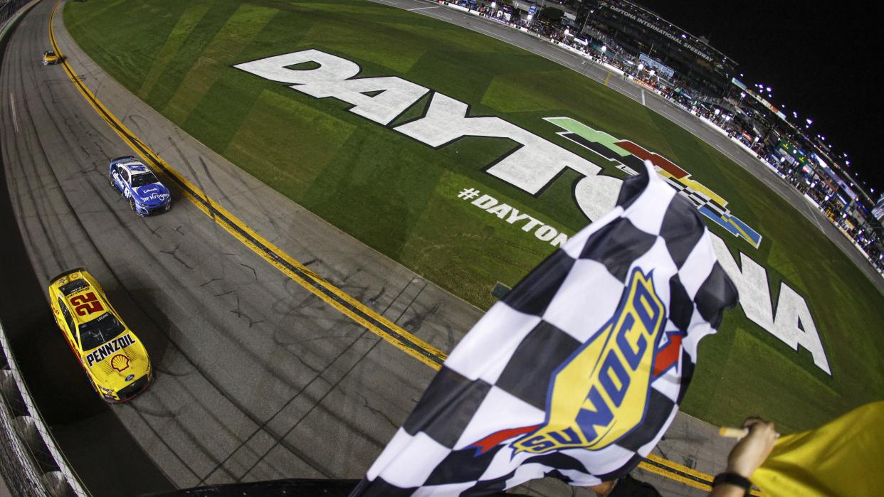  Ricky Stenhouse Jr., driver of the #47 Kroger/Cottonelle Chevrolet, and Joey Logano, driver of the #22 Shell Pennzoil Ford, race to the checkered flag under caution at the NASCAR Cup Series 65th Annual Daytona 500 at Daytona International Speedway . 