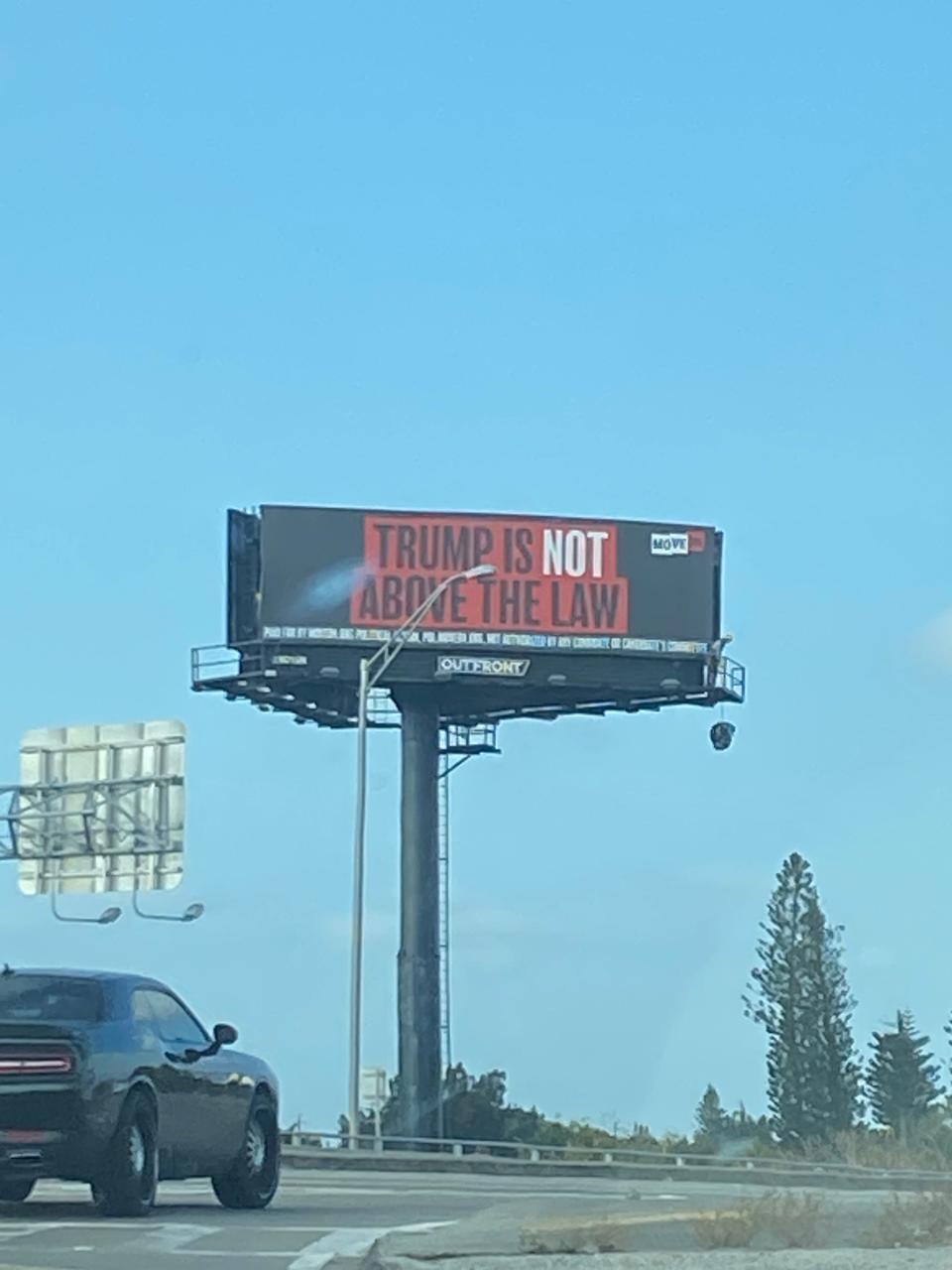 A billboard in West Palm Beach not far from the roadway former President Trump will travel on his way to Palm Beach International Airport.