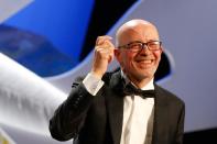 French director Jacques Audiard celebrates winning the Palme d'Or at Cannes