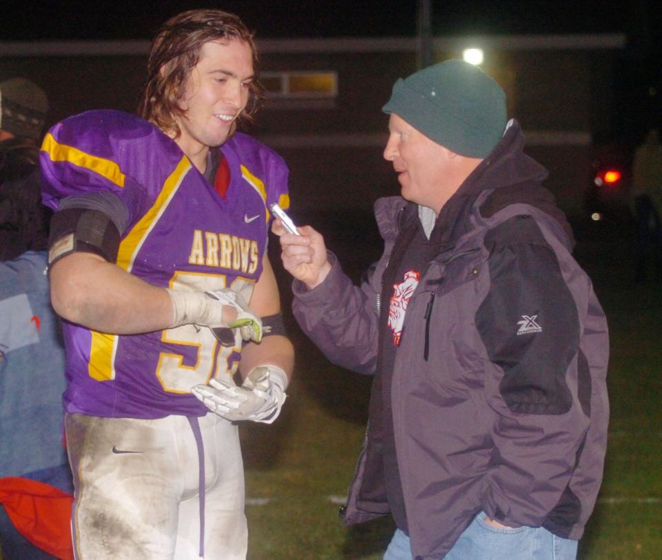 Defensive lineman Harrison Jones explains his fumble recovery and touchdown to Public Opinion sports writer Roger Merriam after Watertown downed Yankton 32-14 in the semifinals of the 2013 state Class 11AA football playoffs at Watertown Stadium.