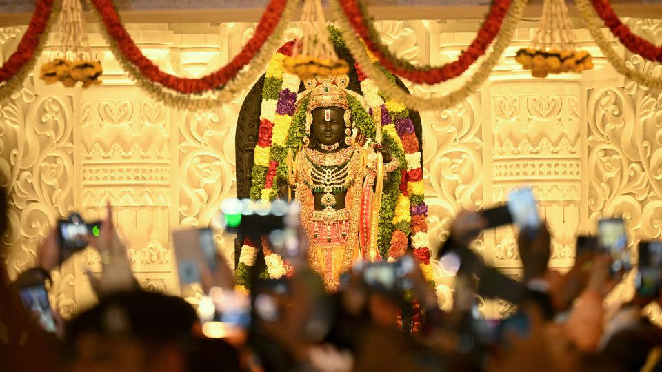 Devotees gather near the idol of Hindu deity Ram at the newly consecrated temple in Ayodhya in India's Uttar Pradesh state on January 22, 2024. - Money Sharma/AFP/Getty Images