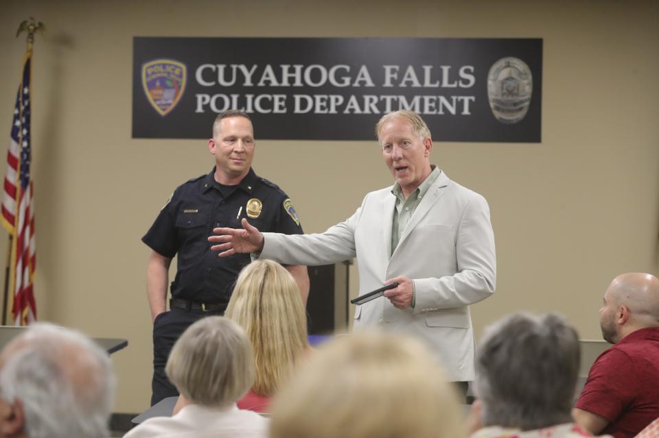 Cuyahoga Falls Mayor Don Walters and new Police Chief Chris Norfolk talk to residents gathered at the Police Training Center for a Neighborhood Ambassador meeting May 2 in Cuyahoga Falls.