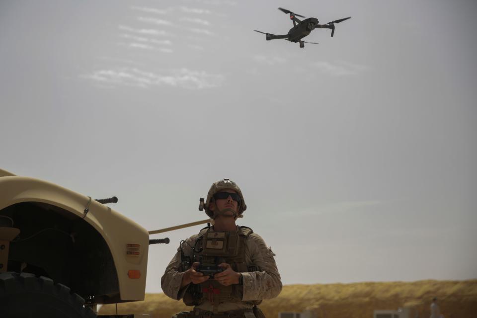 US Marine Corps Sgt. Paul Butcher, an explosive ordnance disposal technician with Special Purpose Marine Air-Ground Task Force-Crisis Response-Central Command, flies a DJI Mavic Pro Drone while forward deployed in the Middle East on May 25, 2017.