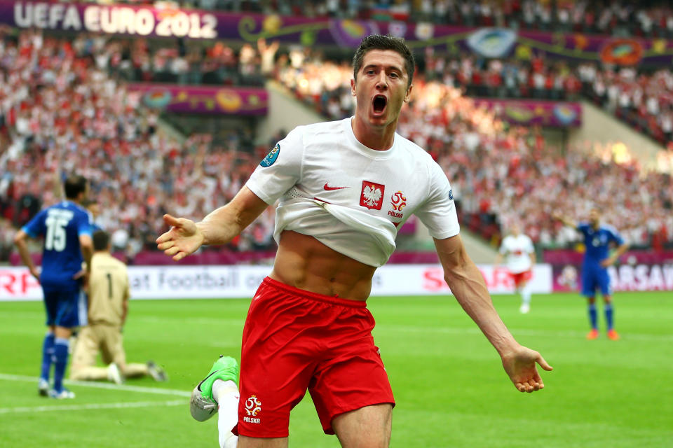 WARSAW, POLAND - JUNE 08: Robert Lewandowski of Poland celebrates scoring the opening goal during the UEFA EURO 2012 Group A match between Poland and Greece at National Stadium on June 8, 2012 in Warsaw, Poland. (Photo by Michael Steele/Getty Images)