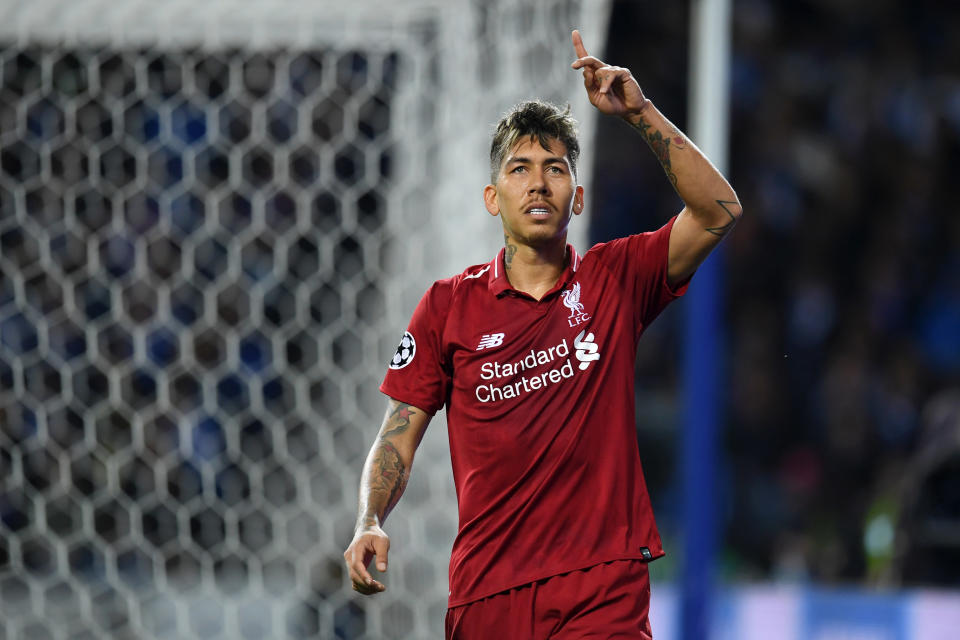 Roberto Firmino of Liverpool celebrates after scoring his team's third goal.