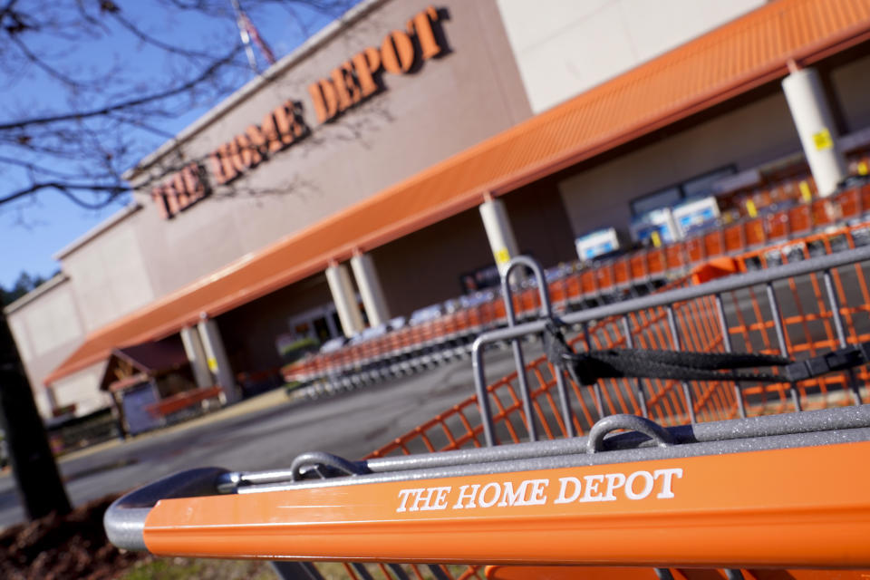 Shopping carts are lined up at The Home Depot store on Monday, Feb. 22, 2021, in Cornelius, N.C. The Home Depot’s fiscal fourth-quarter sales surged 25% as the home improvement chain continues to meet the demands of consumers stuck at home and a resilient housing market. (AP Photo/Chris Carlson)