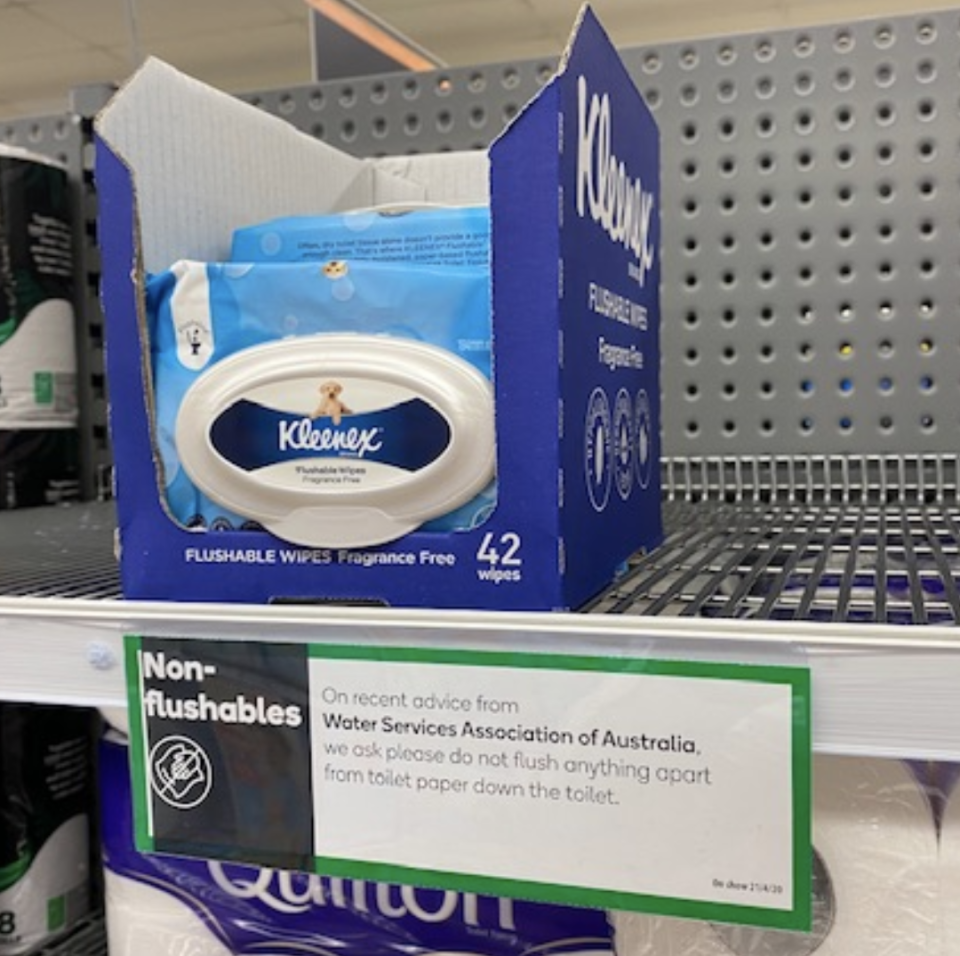 The Woolies sign is seen in front of "flushable" wet-wipes. Source: WSAA