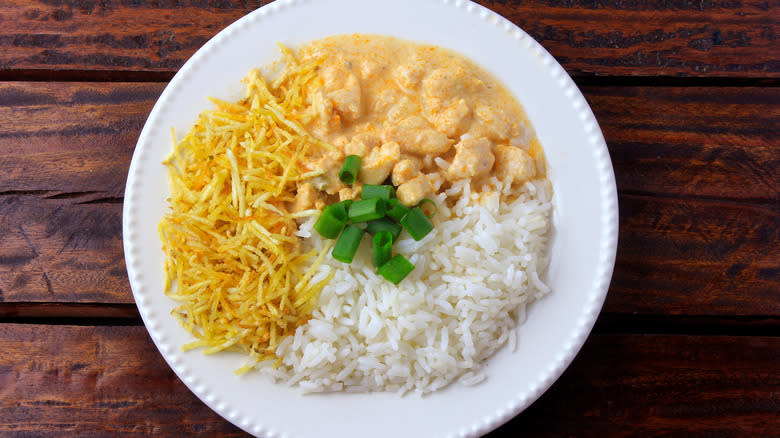 Brazilian chicken stroganoff with potato sticks 