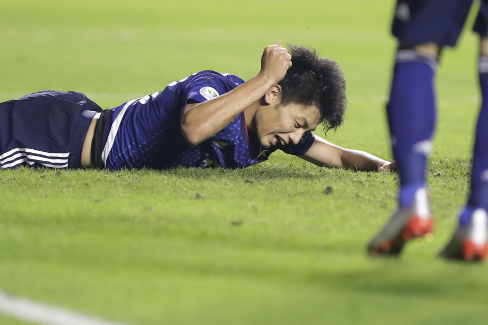 Japan's Ayase Ueda shows his frustration after missing a chance to score against Chile's during a Copa America Group C soccer match at the Morumbi stadium in Sao Paulo, Brazil, Monday, June 17, 2019. (AP Photo/Andre Penner)