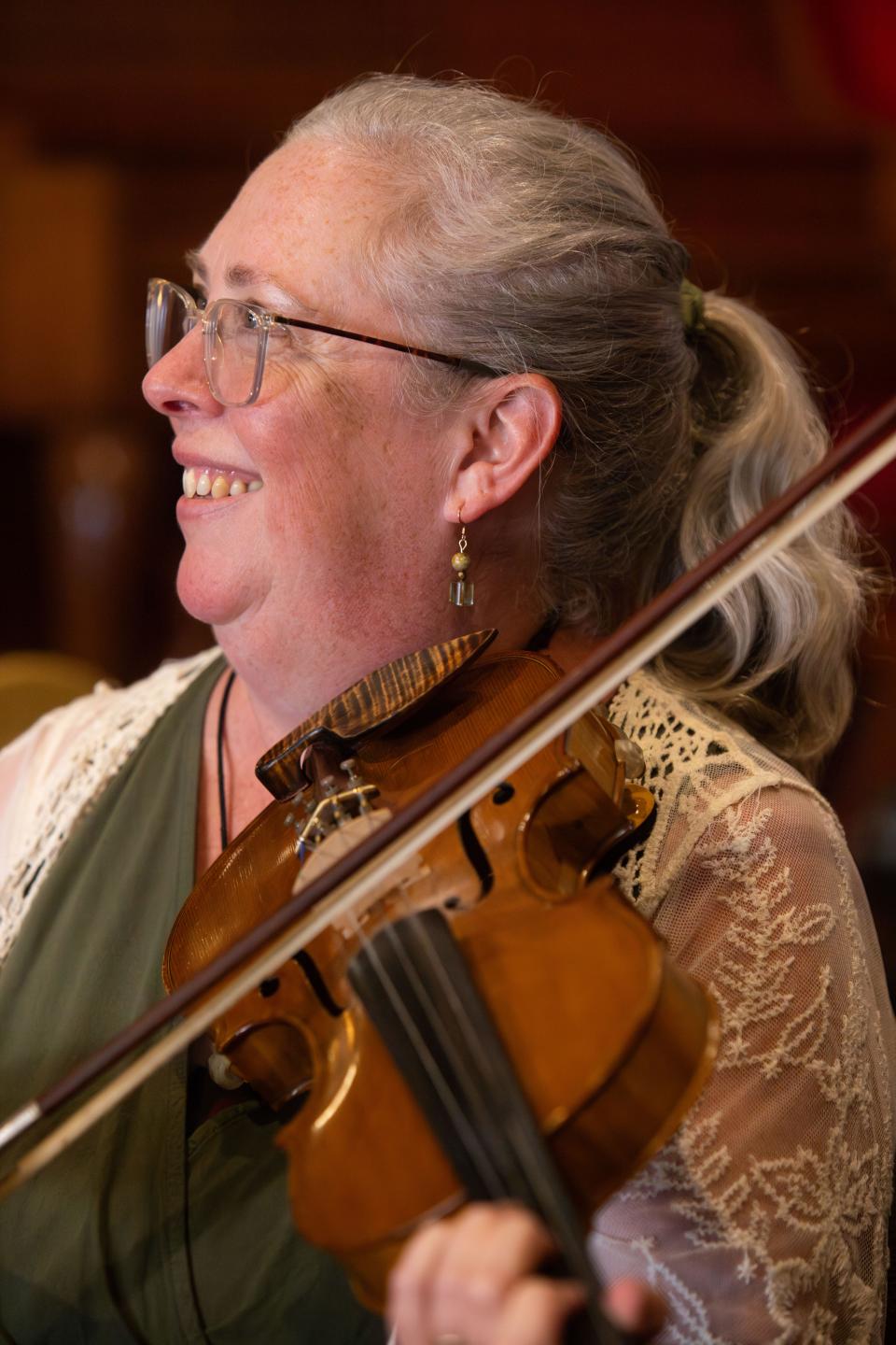 Sarah Pirkle, program director for the Junior Appalachian Musicians of North Knoxville, plays the fiddle during a weekly Old Time Jam at the Jig & Reel on Tuesday, September 19, 2023.