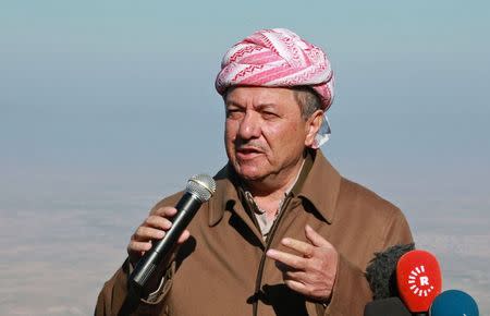 Iraqi Kurdish regional President Massoud Barzani speaks with the media at Mount Sinjar, in the town of Sinjar, December 21, 2014. REUTERS/Ari Jalal