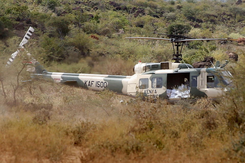 A Kenya Air Force rescue helicopter is seen near the scene where the Kenya Air Force Mi 171 E helicopter crashed in the county of Kajiado, Kenya June 24, 2021. REUTERS/Stringer