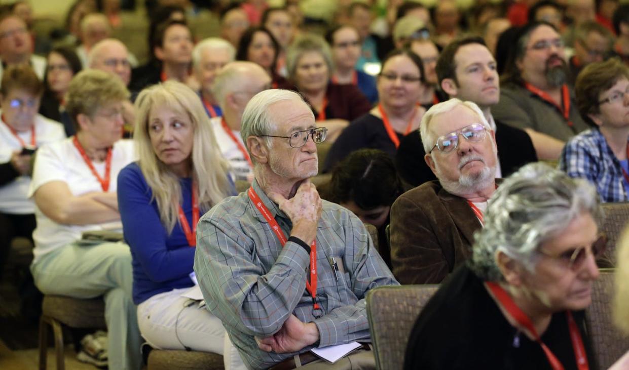 <span class="caption">People in attend a talk at the American Atheists National Convention in 2014. Many Americans remain distrustful of atheists, surveys show.</span> <span class="attribution"><a class="link " href="https://newsroom.ap.org/detail/AtheistConferenceUtah/7b1a427c335b4a6695c09ebfdc631e31/photo?Query=atheist&mediaType=photo&sortBy=&dateRange=Anytime&totalCount=338&currentItemNo=8" rel="nofollow noopener" target="_blank" data-ylk="slk:AP Photo/Rick Bowmer;elm:context_link;itc:0;sec:content-canvas">AP Photo/Rick Bowmer</a></span>