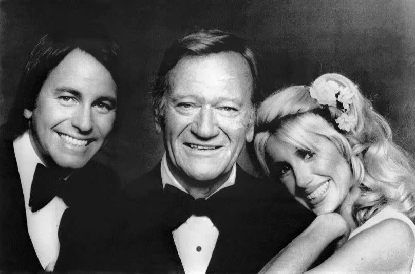 John Ritter and Suzanne Somers welcome John Wayne back to the set during the filming of &quot;General Electric All Star Anniversary&quot; in Los Angeles, United States, on July 10, 1978