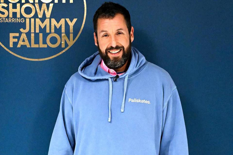 <p>Todd Owyoung/NBC via Getty Images</p> Adam Sandler poses backstage at the Tonight Show in December 2022