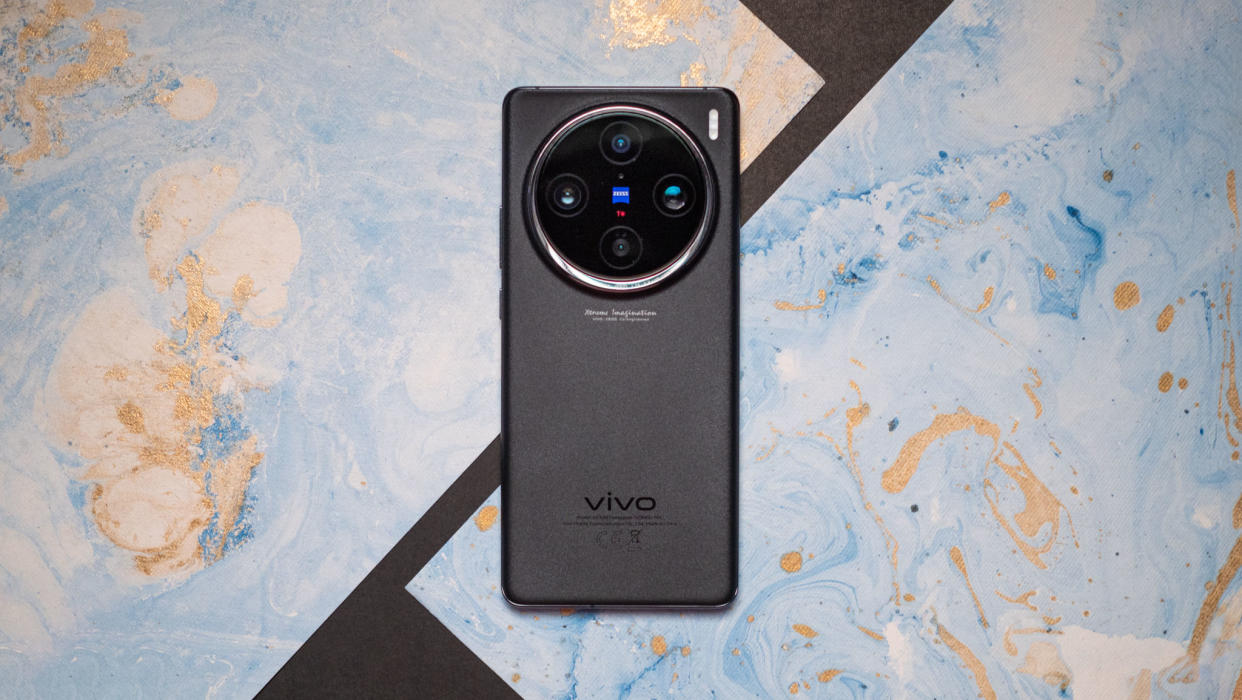  Vivo X100 Pro against colorful background. 