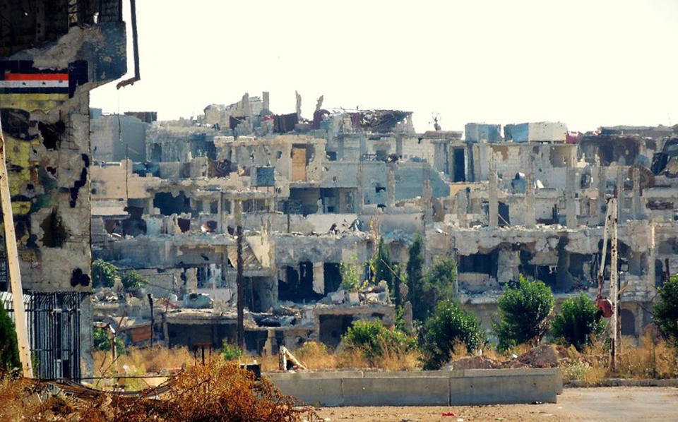 In this citizen journalism image provided by Lens Young Homsi, which has been authenticated based on its contents and other AP reporting, a general view of destroyed houses which was damaged by Syrian government forces shelling, at Baba Amr neighborhood, in Homs province, Syria, Thursday Oct. 18, 2012. Syrian activists say a string of government airstrikes on rebel areas in the country's north has killed at least 20 people, leveled buildings and forced residents to dig through mounds of rubble in search of survivors. (AP Photo/Lens Yong Homsi)