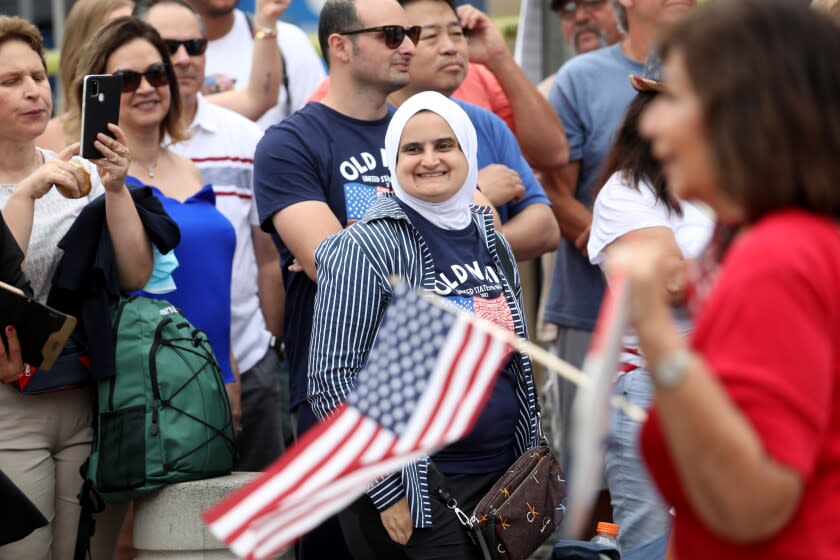 HUNTINGTON BEACH, CA - JULY 04: Parade goers at the Huntington Beach Fourth of July Parade along Main Street in downtown on Monday, July 4, 2022 in Huntington Beach, CA. (Gary Coronado / Los Angeles Times)