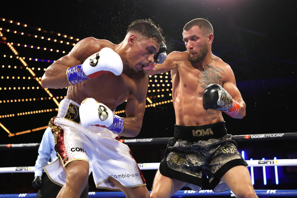 Vasiliy Lomachenko (right) punches Jamaine Ortiz during their lightweight bout at The Hulu Theater at Madison Square Garden on October 29, 2022 in New York City.  (Photo by Al Bello/Getty Images)