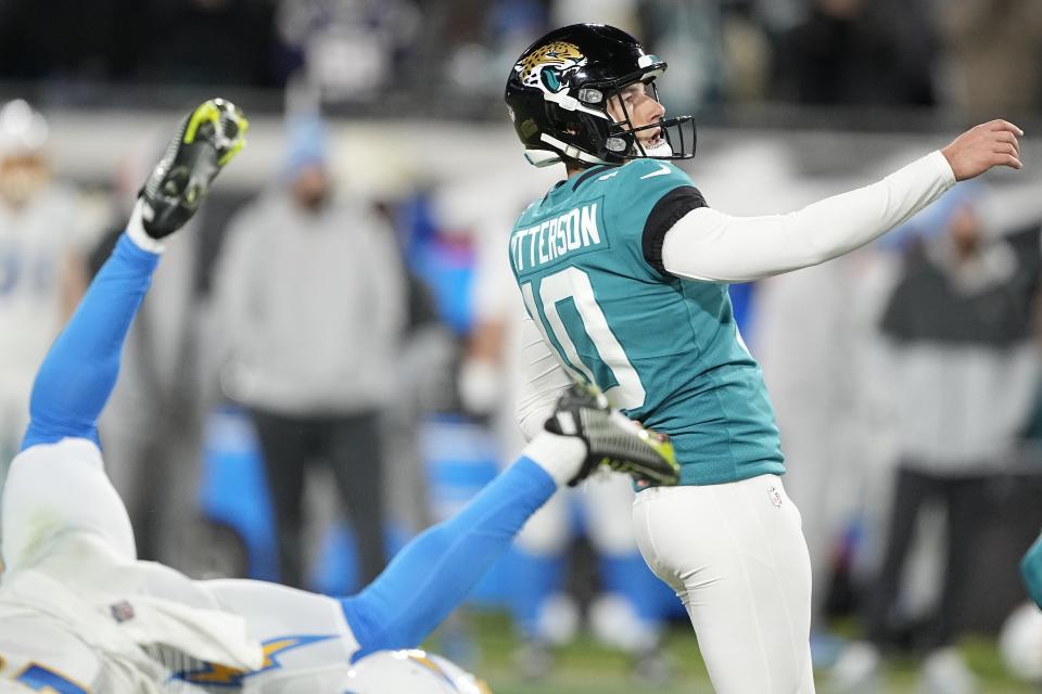 Jacksonville Jaguars place kicker Riley Patterson (10) watches his game-winning field goal during the second half of an NFL wild-card football game against the Los Angeles Chargers, Saturday, Jan. 14, 2023, in Jacksonville, Fla. Jacksonville Jaguars win 31-30. (AP Photo/Chris Carlson)