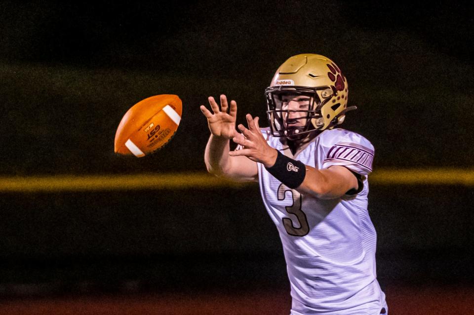 Old Colony's Matt McGuiggan takes the snap.