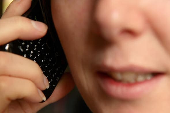 PICTURE POSED MY MODEL File photo dated 15/03/11 of a close-up view of a woman talking on a mobile phone as nuisance calls and texts are affecting the vast majority of people despite most having taken steps to eliminate them, a survey has found. PRESS ASSOCIATION Photo. Issue date: Friday March 14, 2014. Almost nine in 10 telecoms users (87%) receive calls from withheld numbers, with 40% receiving them at least once a week and 9% at least one a day, according to price comparison site uSwitch.com. Among mobile users, 80% receive unwanted telephone marketing calls, with 18% receiving at least one a week and 15% receiving at least three a week. See PA story CONSUMER Nuisance. Photo credit should read: Dave Thompson/PA Wire