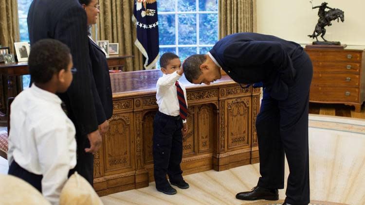 In this photo from May of 2008, Jacob Philadelphia, 5, touches President Barack Obama&#8217;s hair to see if it feels like his own hair.