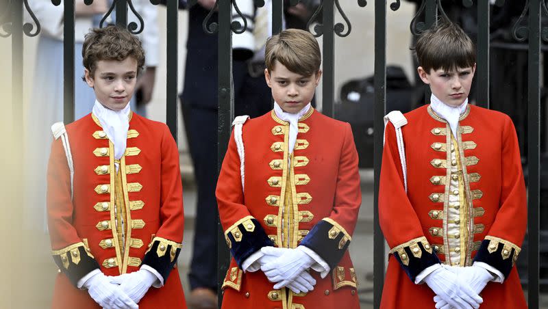 Britain’s Prince George, center, stands at Westminster Abbey to attend Britain’s King Charles III and Queen Camilla coronation ceremony, in London, Saturday, May 6, 2023. 