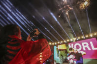 Albanian fans react as they watch on a giant screen, the Euro 2024 group E qualifying soccer match between Moldova and Albania at Skanderbeg square, in Tirana, Albania, Friday, Nov. 17. 2023. The match ended 1-1 and the national team qualified for the Euro 2024 in Germany. (AP Photo/Armando Babani)