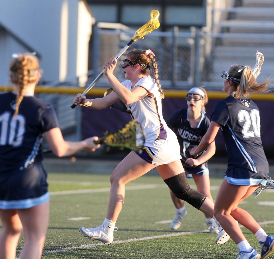 Lauren Pallotta, 1, of Jackson takes a shot while being guarded by Lindsey Rohwedder, 10, and Ryan St. Pierre, 20, of Hudson during their game at Jackson on Thursday, 