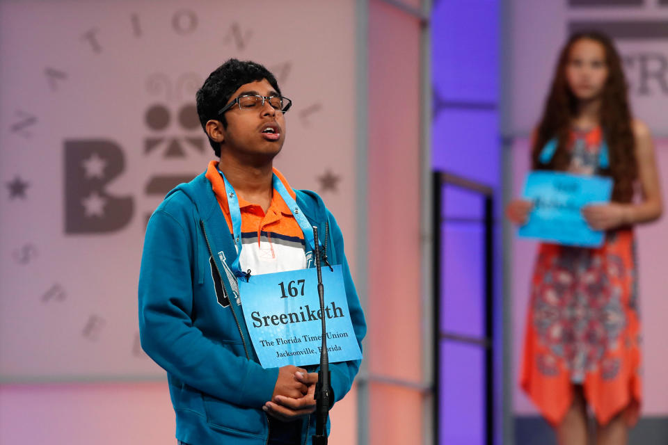 <p>Sreeniketh Vogoti, 14, of Saint Johns, Fla., left, thinks about how to spell his word, as Rebekah Zeigler, 12, of Polo, Ill., waits her turn, during the 90th Scripps National Spelling Bee in Oxon Hill, Md., Wednesday, May 31, 2017. (AP Photo/Jacquelyn Martin) </p>