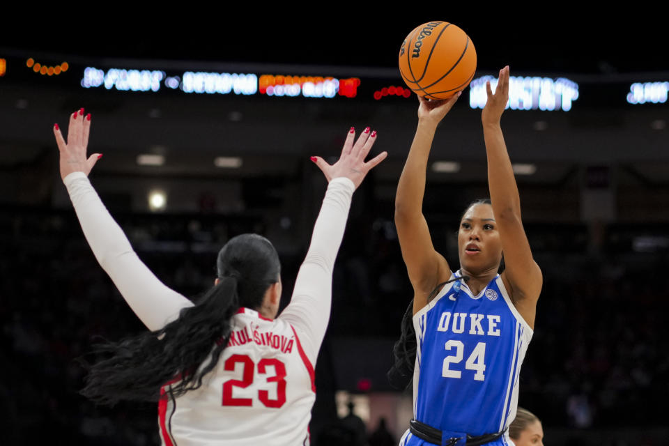 Duke guard Reigan Richardson (24) shoots against Ohio State forward Rebeka Mikulasikova (23) during the first half of a second-round college basketball game in the women's NCAA Tournament, Sunday, March 24, 2024, in Columbus, Ohio. (AP Photo/Aaron Doster)