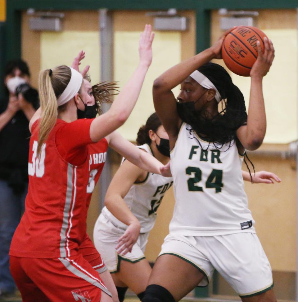 FDR's Nkiru Awaka looks to pass the ball away from Red Hook's Morgan Tompkins during Wednesday's game in Staatsburg on January 26, 2022.