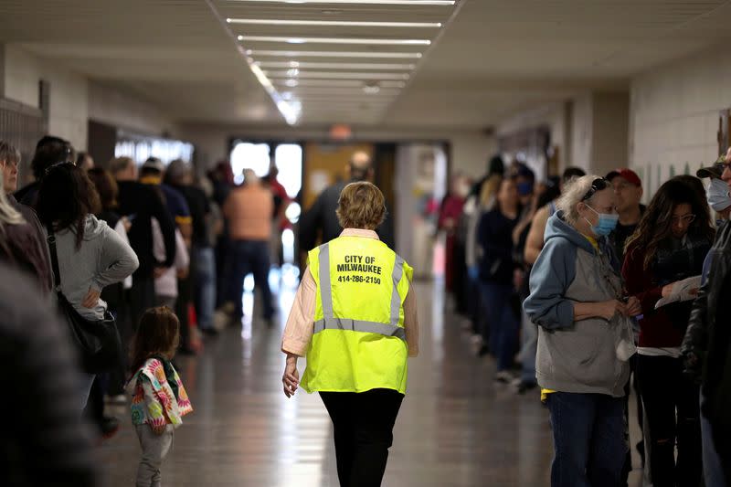 Voters wait to cast ballots during the presidential primary election in Wisconsin