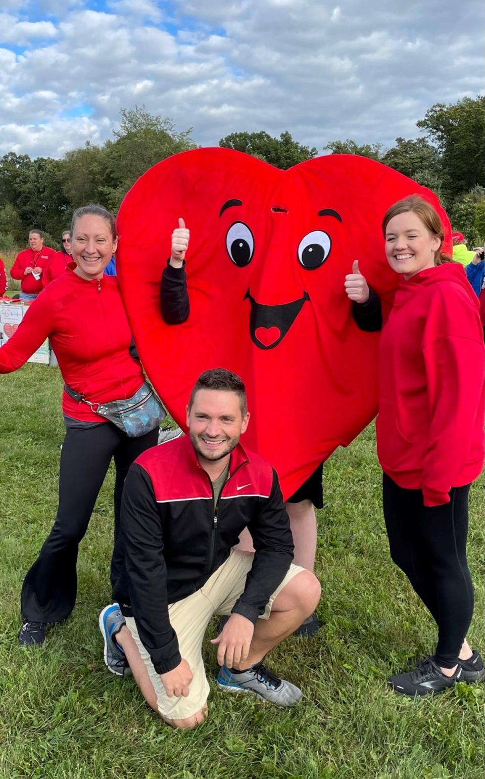Walkers pose with a smiley heart at the 2022 Wayne County Heart Walk. Register for this year's event at heart.org/wayneheartwalk.