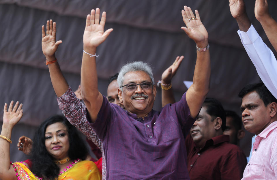 Sri Lankan presidential candidate and former defense chief Gotabaya Rajapaksa waves to his supporters during a rally in Neluwa village in Galle, Sri Lanka, Tuesday, Oct. 22, 2019. Rajapaksa is the front-runner in Sri Lanka's upcoming presidential election. (AP Photo/Eranga Jayawardena)