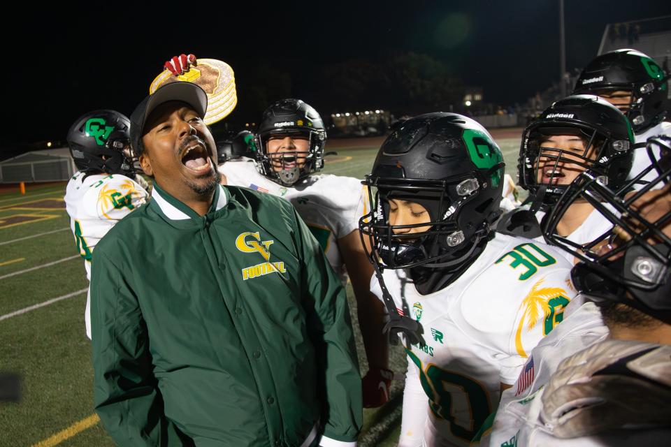 Coach Bill Johnson and the team celebrate a resounding victory after defeating Don Lugo 52-35 in the CIF-SS Division 12 playoffs in Chino, California, on November 10, 2023.