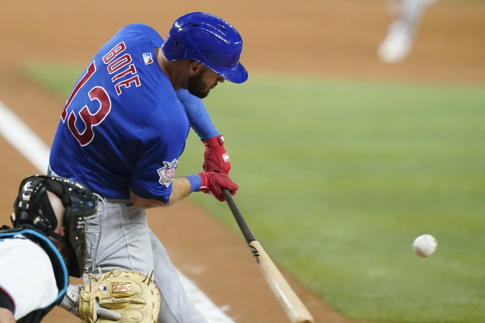 Chicago Cubs' David Bote hits an RBI sacrifice fly during the eighth inning of the team's baseball game against the Miami Marlins, Tuesday, Sept. 20, 2022, in Miami. The Cubs won 2-1. (AP Photo/Lynne Sladky)