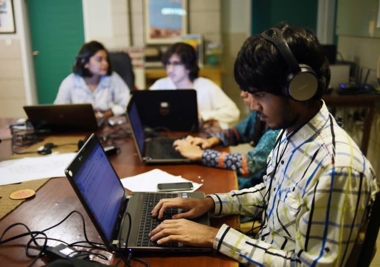 Pakistani volunteers transcribe interviews and testimonies of people who migrated from India to Pakistan at the time of partition at their office of the Citizen Archive of Pakistan in Karachi