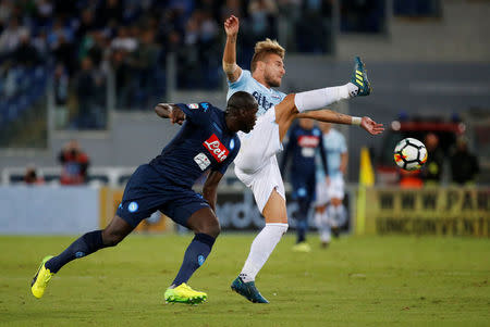 Soccer Football - Serie A - Lazio vs Napoli - Stadio Olimpico, Rome, Italy - September 20, 2017 Lazio’s Ciro Immobile in action with Napoli's Kalidou Koulibaly REUTERS/Ciro De Luca