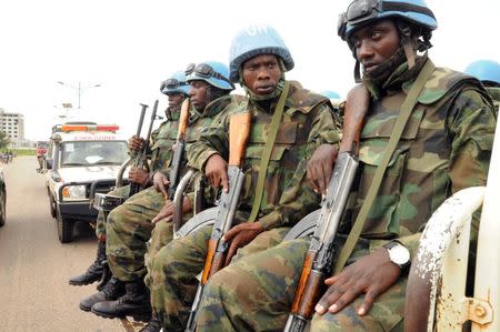 U.N. peacekeepers ride on their truck as they protect internally displaced people during a reallocation at the United Nations Mission in South Sudan (UNMISS) compound at the UN House in Jebel, in South Sudan's capital Juba, August 31, 2016. REUTERS/Jok Solomun