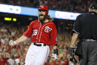 FILE - Washington Nationals right fielder Jayson Werth celebrates after scoring the winning run in a baseball game against the Pittsburgh Pirates, Sunday, Aug. 17, 2014, in Washington. The Nationals won 6-5 in 11 innings. Werth won the World Series with Philadelphia and played 63 playoff games during his major league career with the Toronto Blue Jays, Los Angeles Dodgers, Phillies and Nationals, and still nothing compares with the adrenaline rush of his new favorite sport, horse racing. Werth owns over two dozen thoroughbreds, including Dornoch, who will run in the Kentucky Derby on Saturday, May 4, 2024. (AP Photo/Alex Brandon, File)