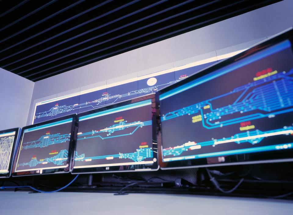 Computer screens depicting a situation at a Chinese railroad network.