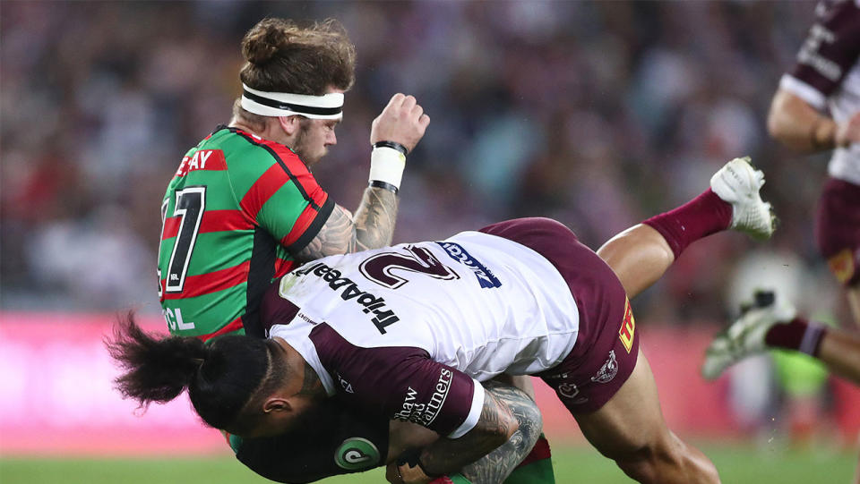 Ethan Lowe takes a heavy tackle from Jorge Taufua. (Getty Images)