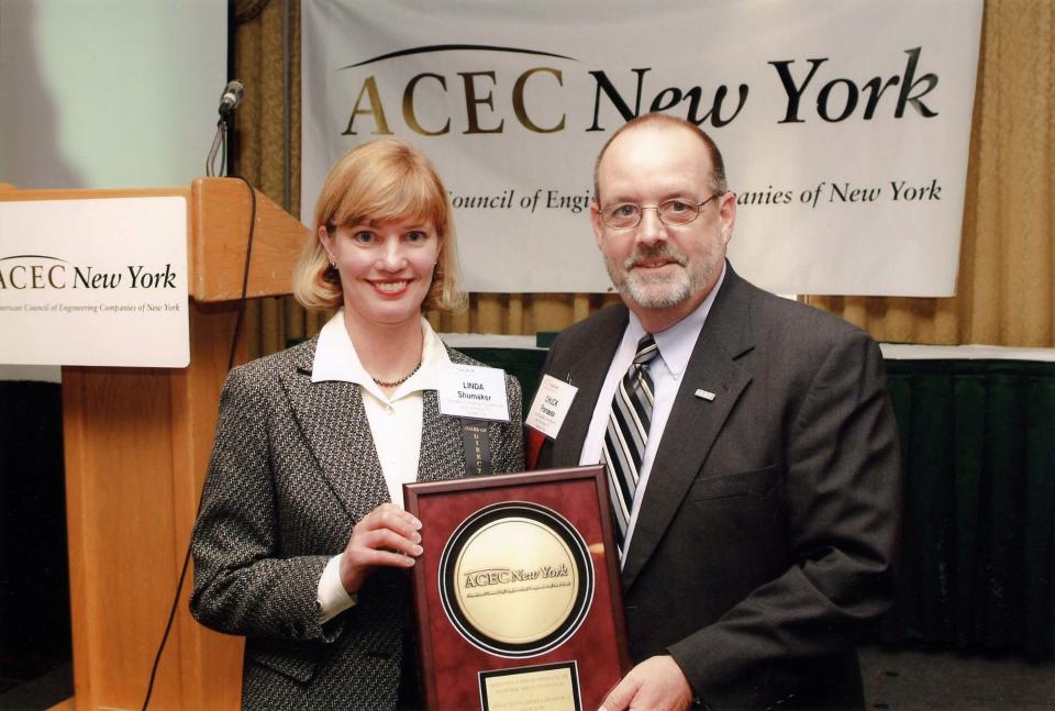 Shumaker Consulting President Linda Shumaker, left, stands with Chuck Franzese of HUNT Engineers at an event in 2006. The companies, which have worked together on projects over the years, are now both operating under the HUNT banner.
