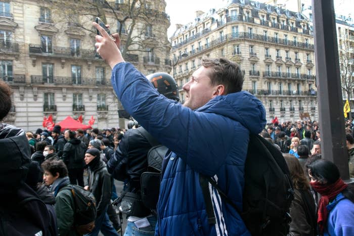 Buisine livestreams from a protest in Paris on April 6, 2023.