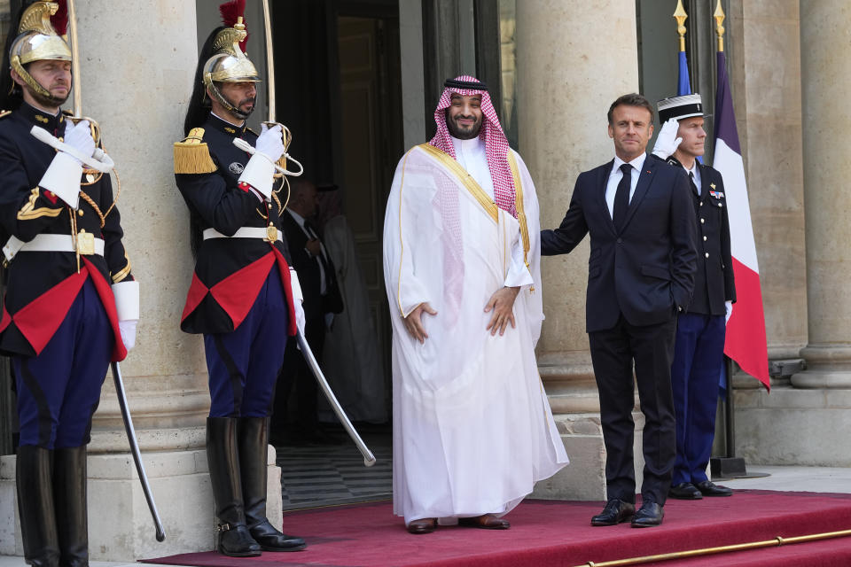 Saudi Crown Prince Mohammed bin Salman poses with French President Emmanuel Macron, Friday, June 16, 2023 at the Elysee Palace in Paris. Saudi Crown Prince Mohammed bin Salman meets Emmanuel Macron as part of an official visit, during which he will also participate in a global financing summit aimed at fighting poverty and climate change. (AP Photo/Michel Euler)