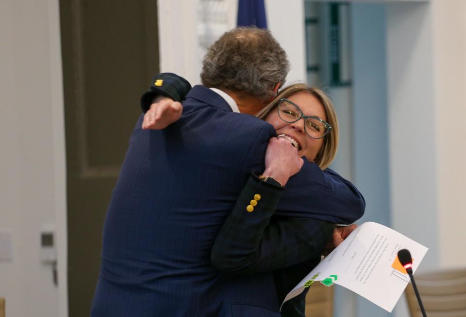 Erin Easter, the new mayor of the City of West Lafayette, hugs John Dennis, the former mayor of the City of West Lafayette after he swore her in at the swearing in ceremony for the 2023 West Lafayette election winners, on Thursday, Dec. 28, 2023, in West Lafayette, Ind.