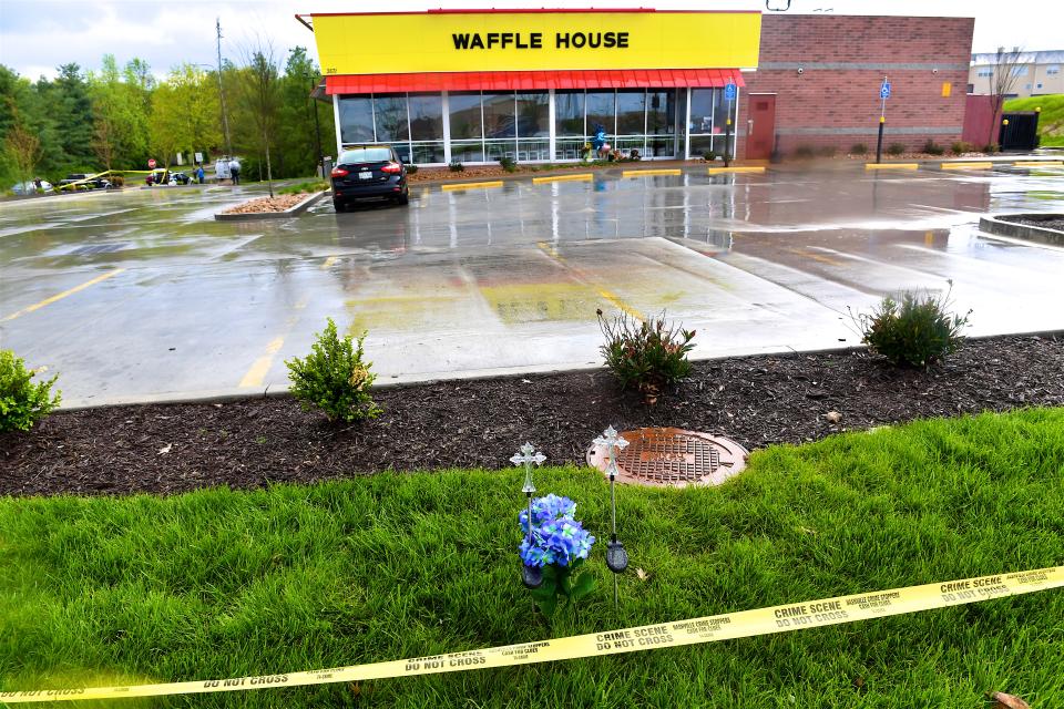 <p>Community members create makeshift memorials for and stop by to pay respects to the victims of the Waffle House shooting on April 24, 2018 in Antioch, Tennessee, where 4 were killed and two were wounded after a gunman entered on April 22. (Photo: Jason Davis/Getty Images) </p>